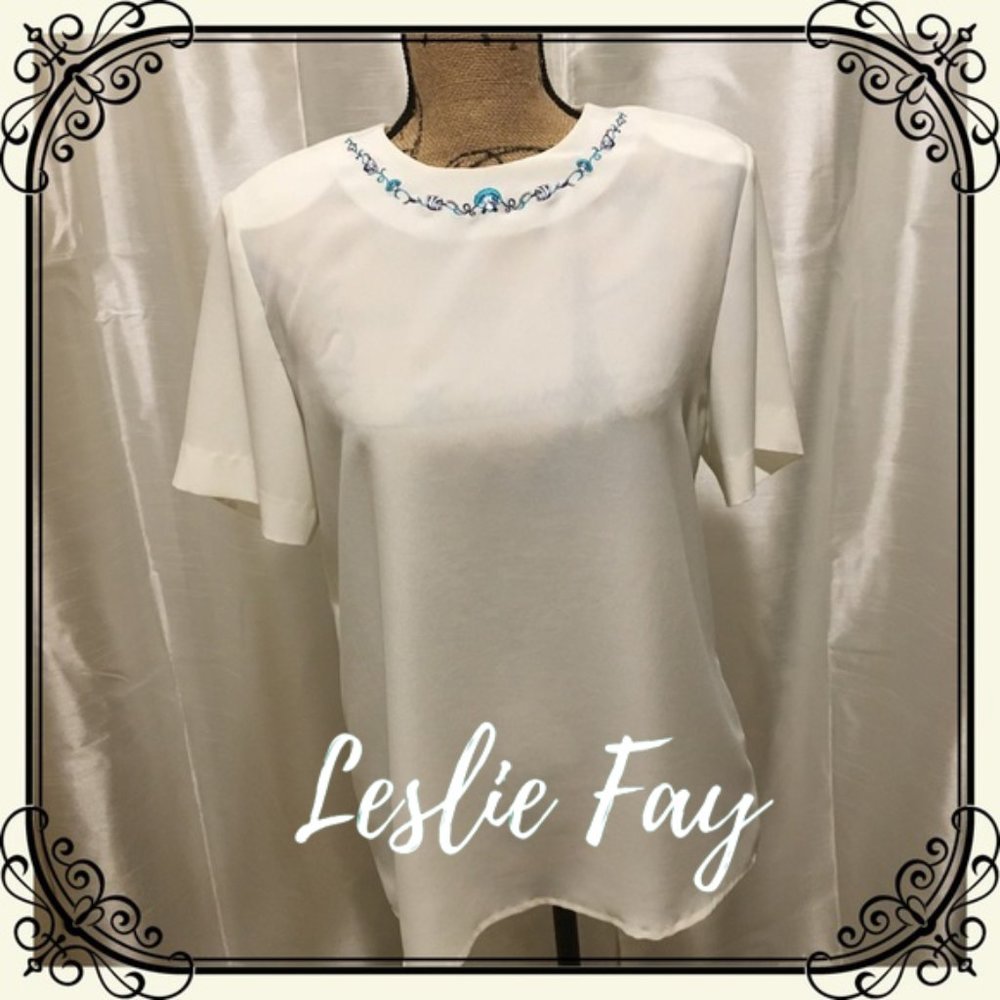 Off white blouse with seashell neckline